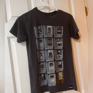 Women’s graphic tee with classic video game cartridges on front
